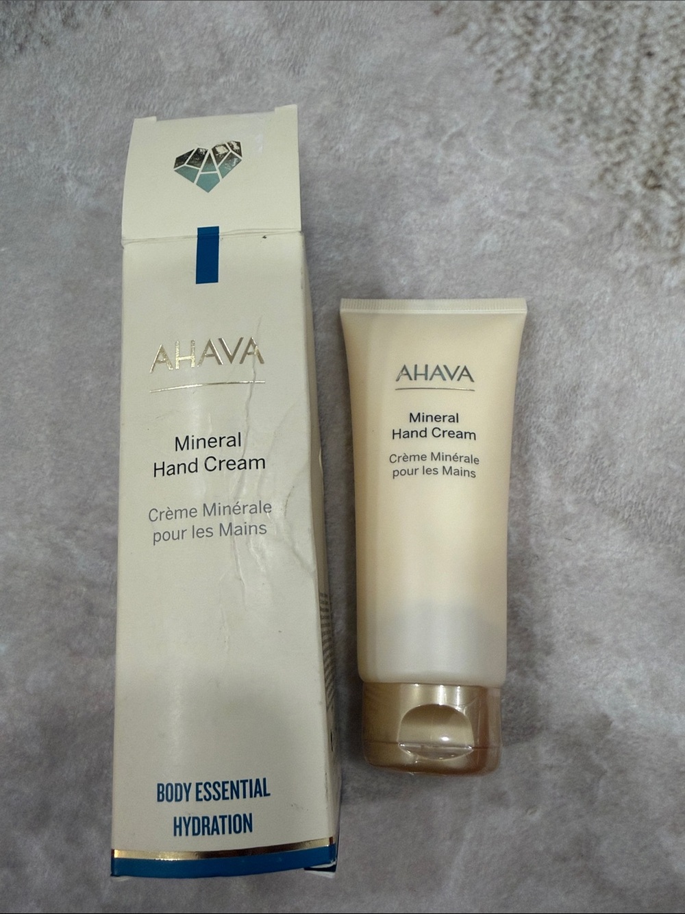 AHAVA Cream Mineral Hand Cream Tube and Box - Cream and Gold Accents